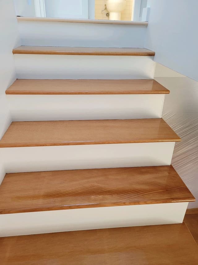 A photo of freshly sealed Doug Fir treads on a staircase.